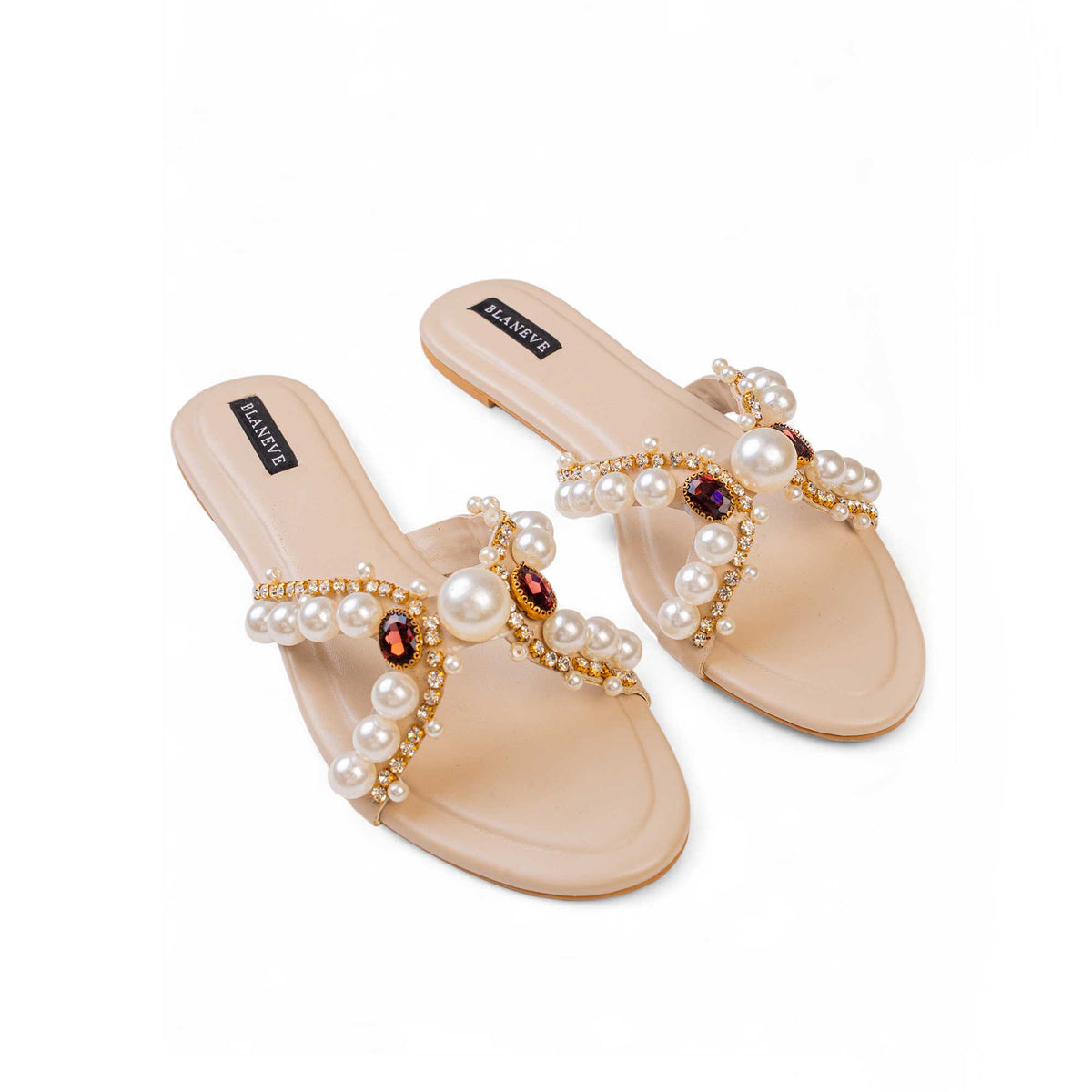 Pair of BLANEVE Reina cream flat slides showing pearl-covered V-straps and central statement pearls