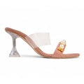 Side view of BLANEVE Orchid mauve backless heel with pearl and gold-toned beads, a clear strap and sculptural heel.