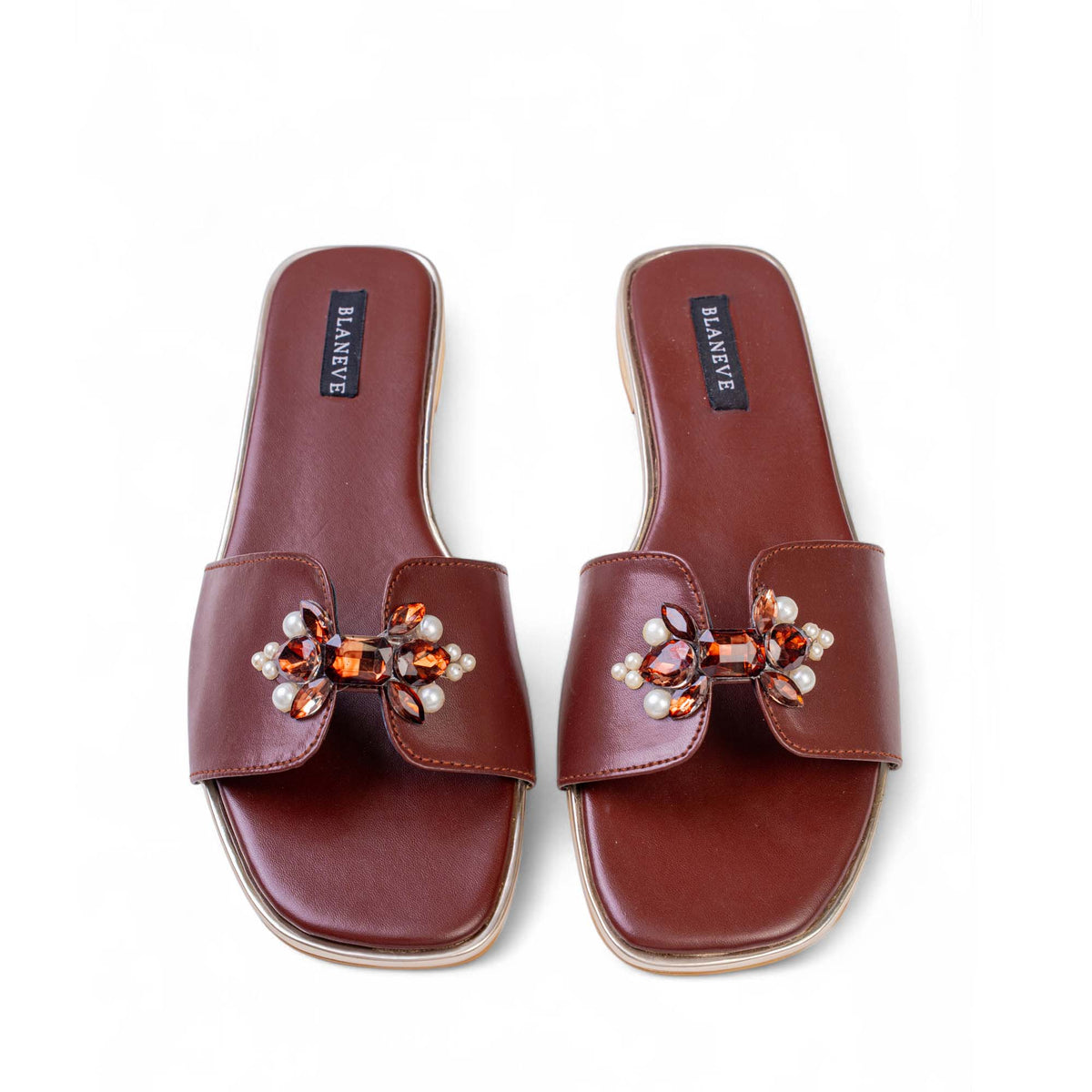 Top view of BLANEVE Cove brown flat slides with pearl and amber-toned bow embellishments