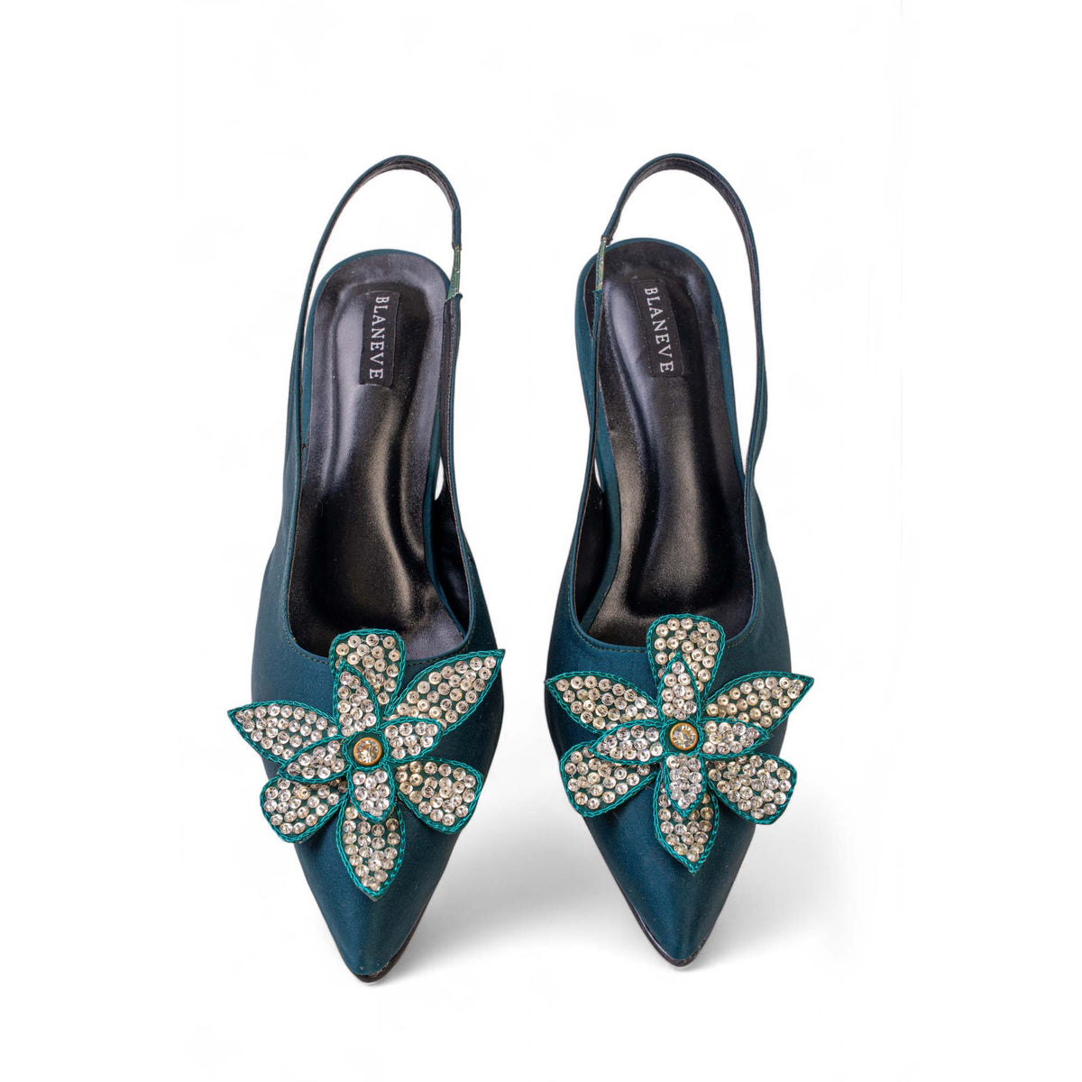 Top view of BLANEVE Lagoon teal pointed-toe slingbacks with silver-toned sequined flowers.