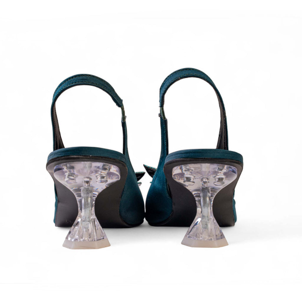 Rear view of BLANEVE Lagoon teal slingback heels showing clear hourglass-shaped heels