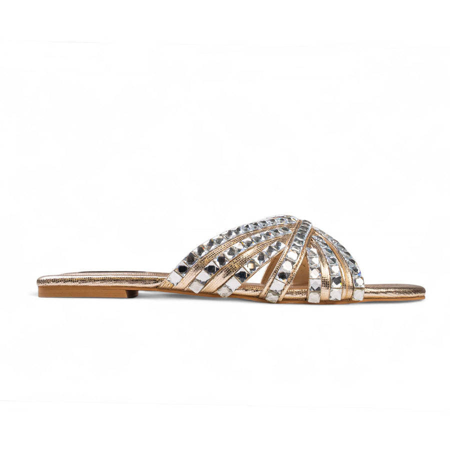 Side view of BLANEVE Halo gold-toned flat slide with crystal-embellished crisscross straps.