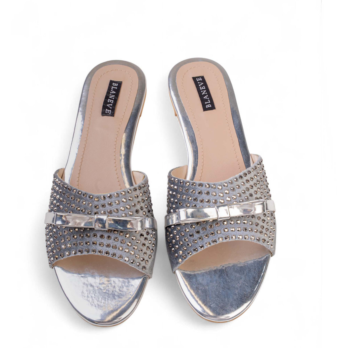 Top view of BLANEVE Starling silver-toned flat slides with open toes, crystal embellishments and metallic bows