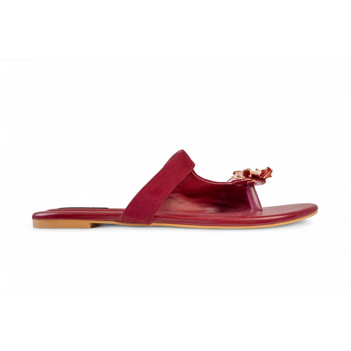 Side view of BLANEVE Merlot maroon flat sandal with a toe post and gold-toned floral ornament